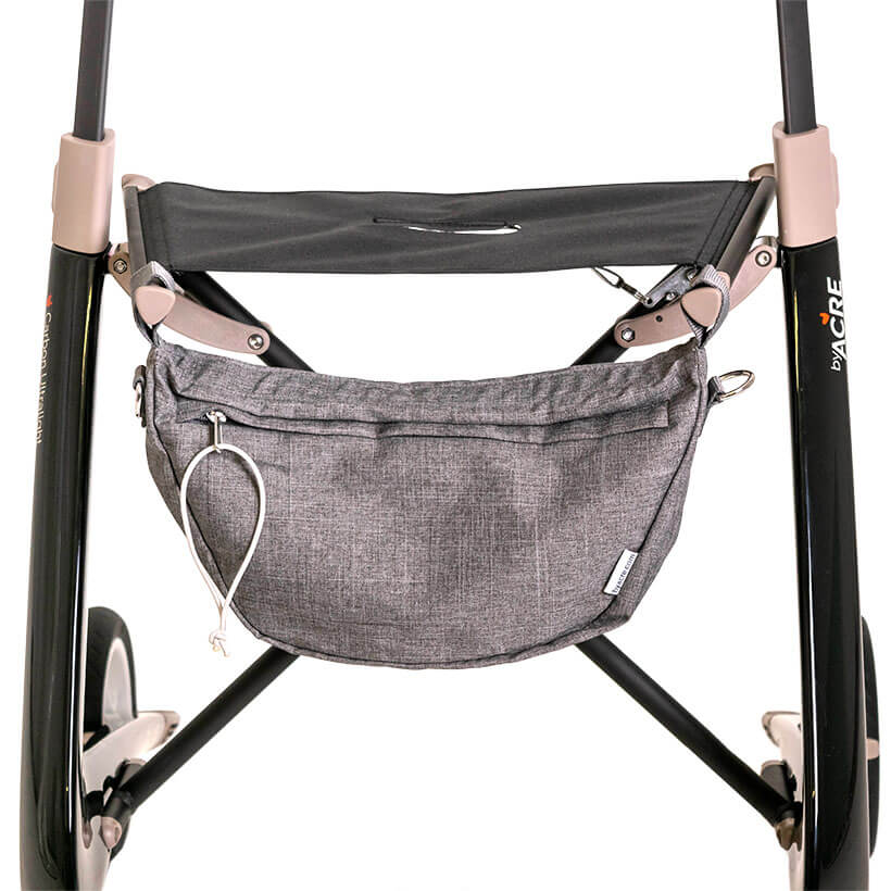 Acre Rollator Modell Ultralight, Frontansicht eines Leichtgewichtrollators in der Farbe Schwarz mit kleiner grauer Einkaufstasche und schwarzer Sitzfläche